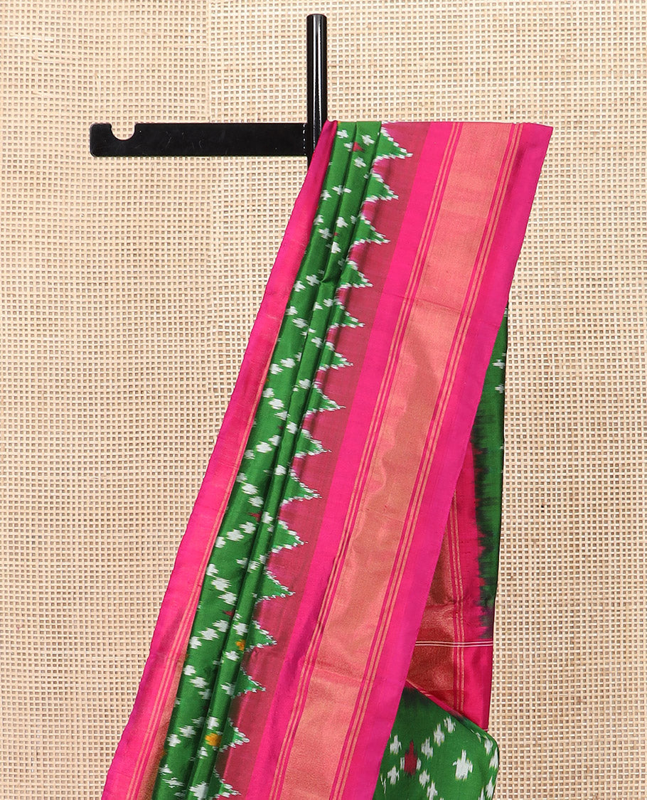 Green Ikkat Silk Saree with Ikkat Buttas Enclosed Jaal Design, Spotlighted with a Contrast Temple Border, Pallu Features Ikkat Jaal Patterns, and with a Contrast Blouse