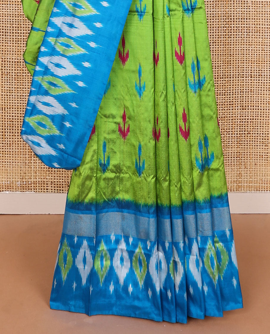 Green ikkat saree with ikkat buttas, contrast ikkat border & pallu of ikkat jaal design