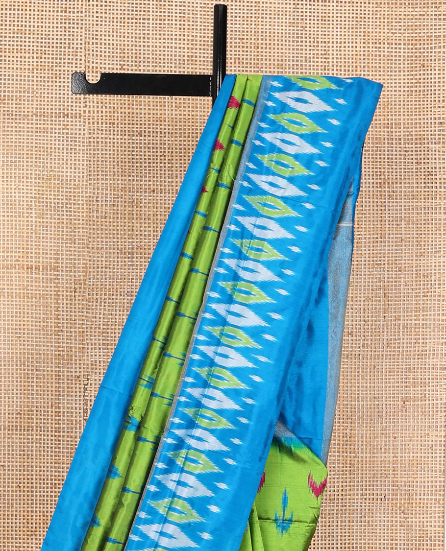Green ikkat saree with ikkat buttas, contrast ikkat border & pallu of ikkat jaal design