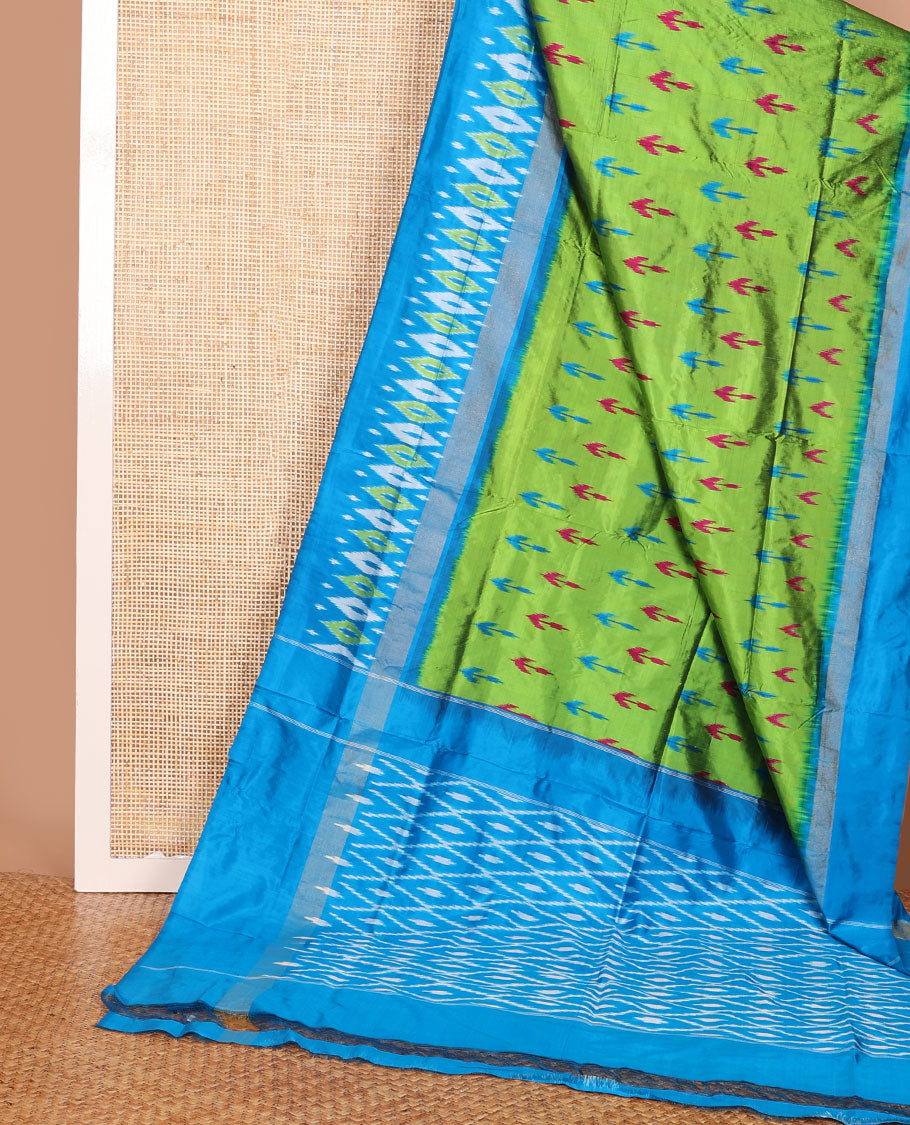 Green ikkat saree with ikkat buttas, contrast ikkat border & pallu of ikkat jaal design