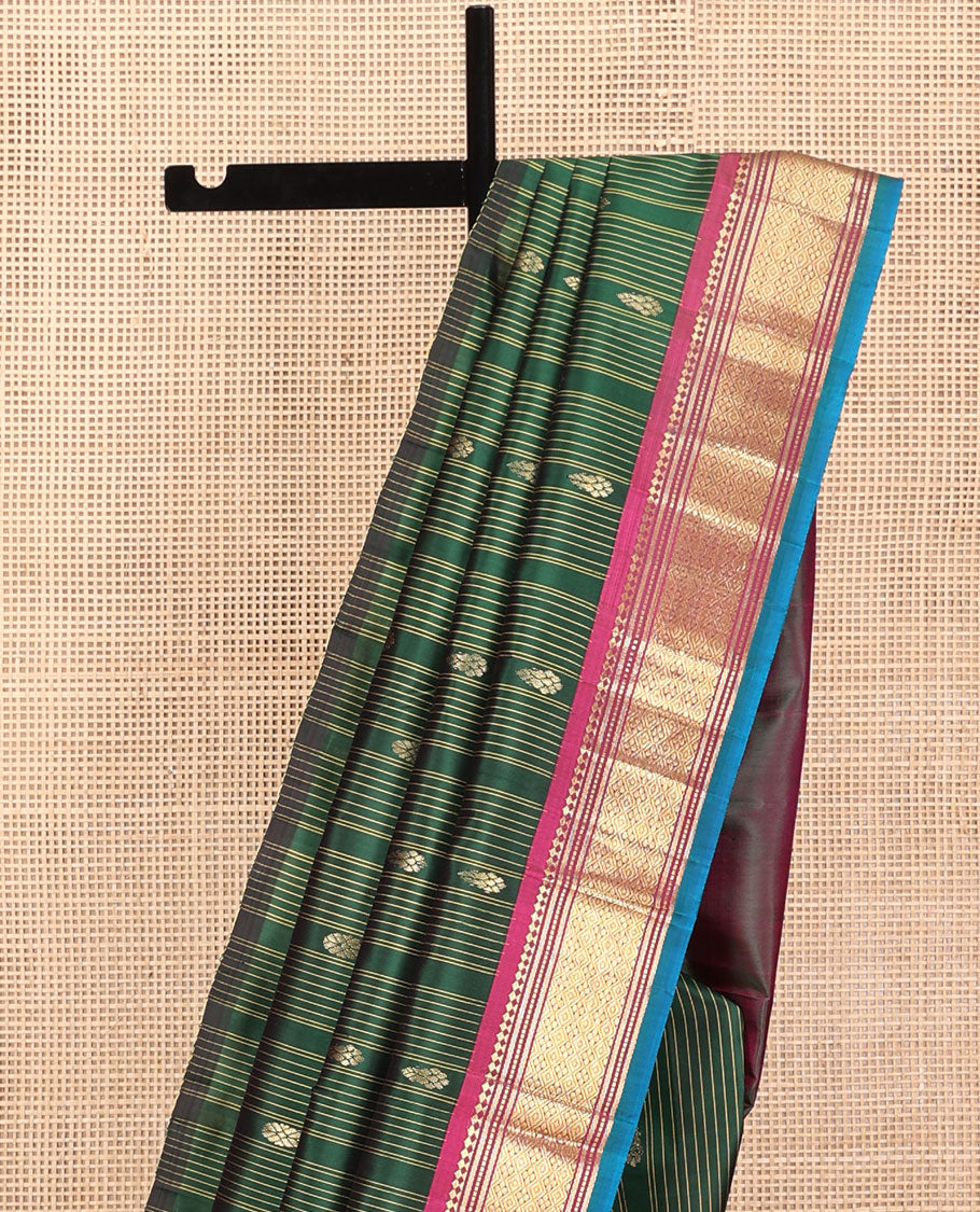 Green Kanchipuram Silk Saree, Adorned with Stripes and Zari Buttas, a Contrast One-Sided Border of Panner Sombu, Banaras, Muthu, and Jaal Design, Zari Design Pallu, and No Blouse