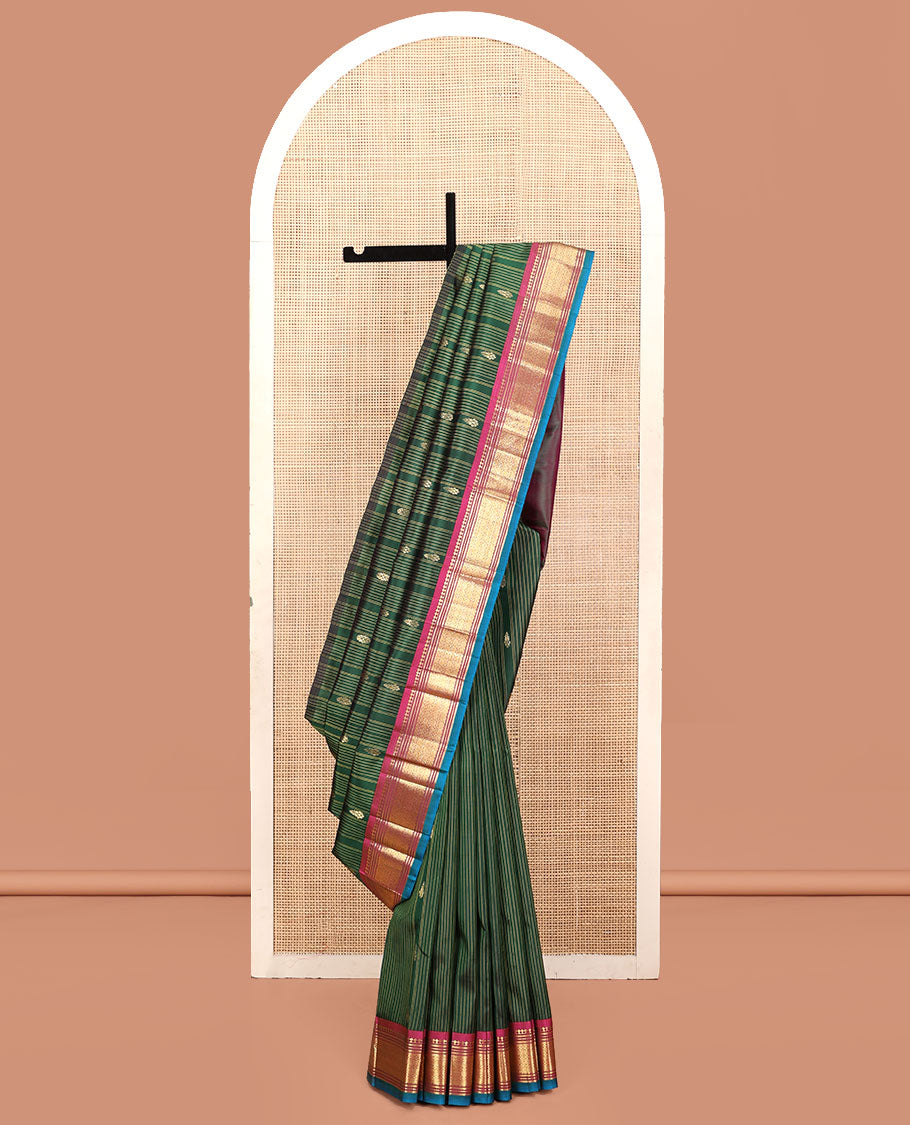 Green Kanchipuram Silk Saree, Adorned with Stripes and Zari Buttas, a Contrast One-Sided Border of Panner Sombu, Banaras, Muthu, and Jaal Design, Zari Design Pallu, and No Blouse