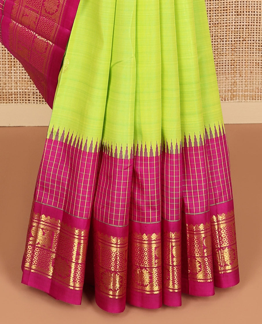 Green floral buttas kancheepuram silk saree with contrast floral design border & intricate zari design pallu