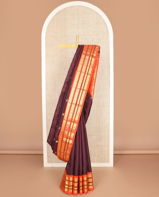 Maroon zari buttas kanchipuram silk saree, contrast one-sided korvai border of salngai,neli,rudraksham, & mayil & paisley design pallu