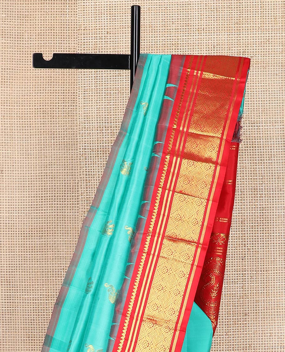 Turquoise yaanai buttas kanchipuram silk saree, contrast thazampoo rekku one-sided border of thilakam mokku,banaras & jaal & butta enclosed jaal pallu