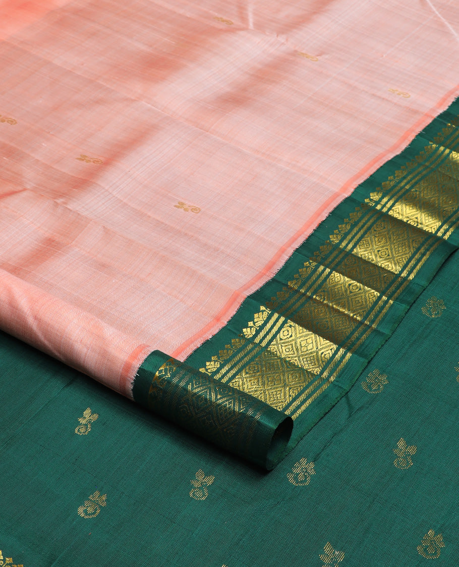 Peach zari buttas Kanchipuram silk saree, contrast one-sided korvai zari design border, and zari design pallu