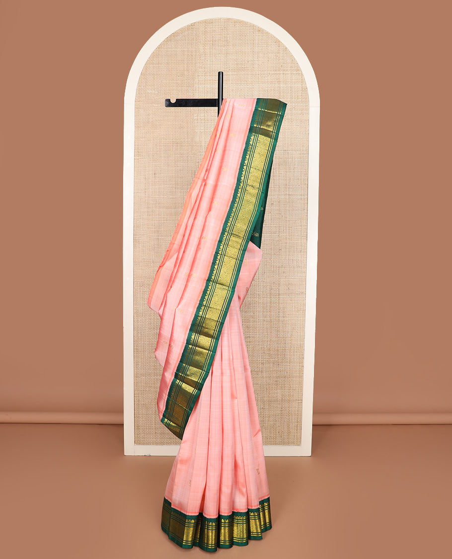 Peach zari buttas Kanchipuram silk saree, contrast one-sided korvai zari design border, and zari design pallu