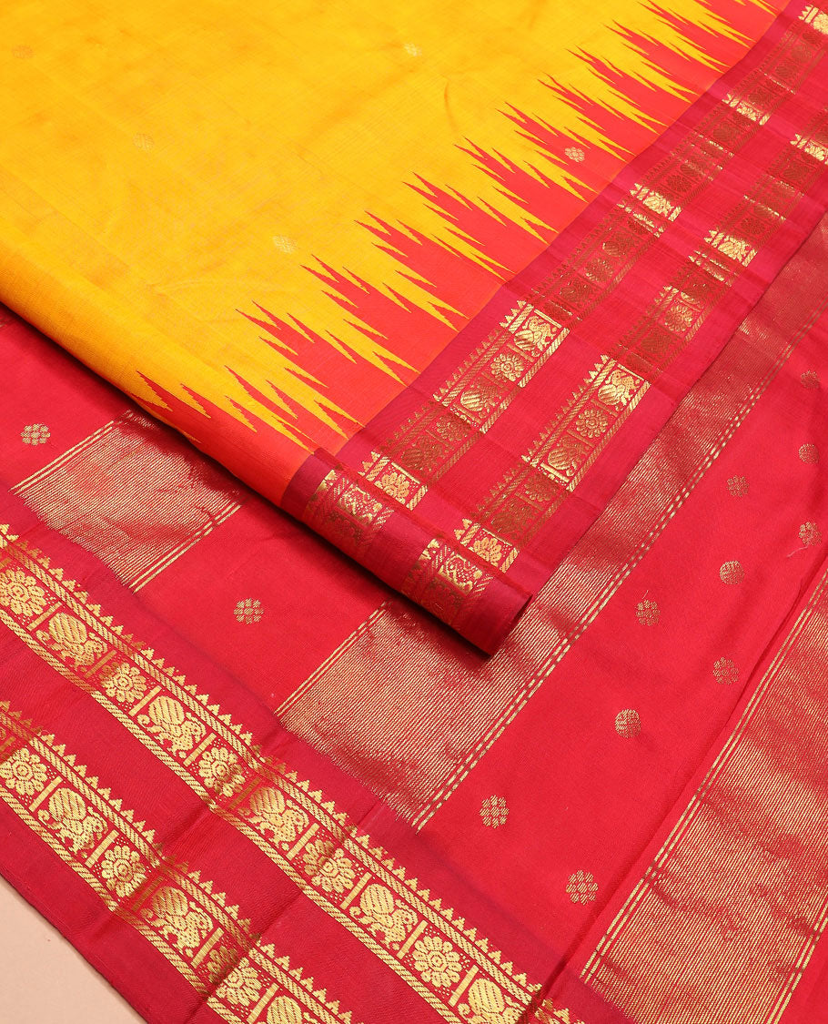 Yellow zari buttas Kanchipuram silk saree, contrast thazampoo rekku border of rekku, banaras, and mayil chakram designs, and zari design pallu