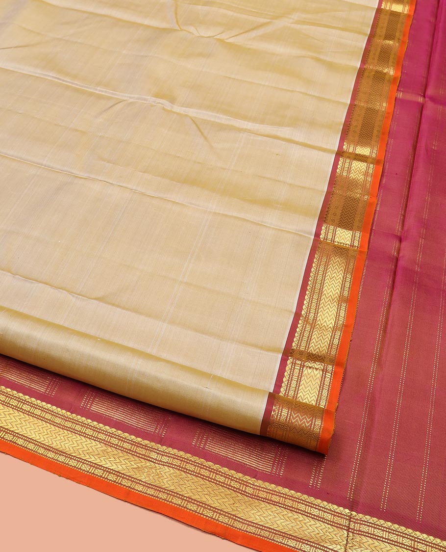 Light Sandal Plain Kanchipuram Silk Saree, Complemented by Contrast Border of Salngai, Muthu, Lavangam, and Vanki Designs, Zari Woven Pallu, and Paired with a Contrast Blouse