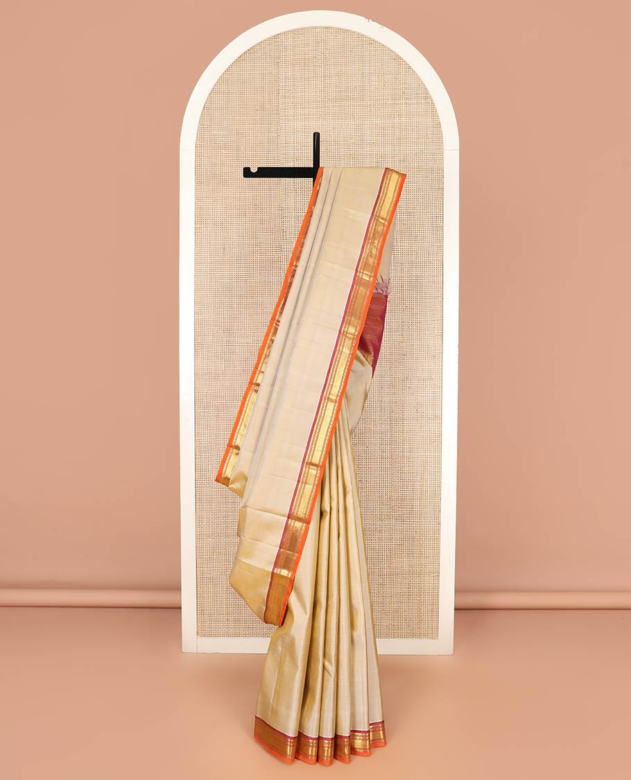 Light Sandal Plain Kanchipuram Silk Saree, Complemented by Contrast Border of Salngai, Muthu, Lavangam, and Vanki Designs, Zari Woven Pallu, and Paired with a Contrast Blouse