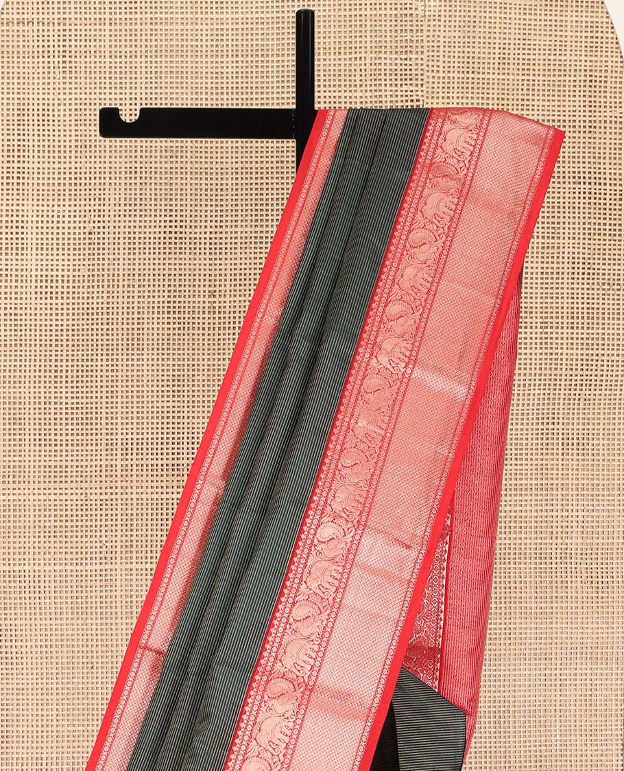 Green Kanchipuram Silk Saree, Bedecked with Stripes All Over Its Body, Complemented by Contrast Border of Mayil, Yaanai, Kamalam, and Mayil Kann Designs, Gleaming Zari-Striped Pallu, and Paired with a Contrast Blouse