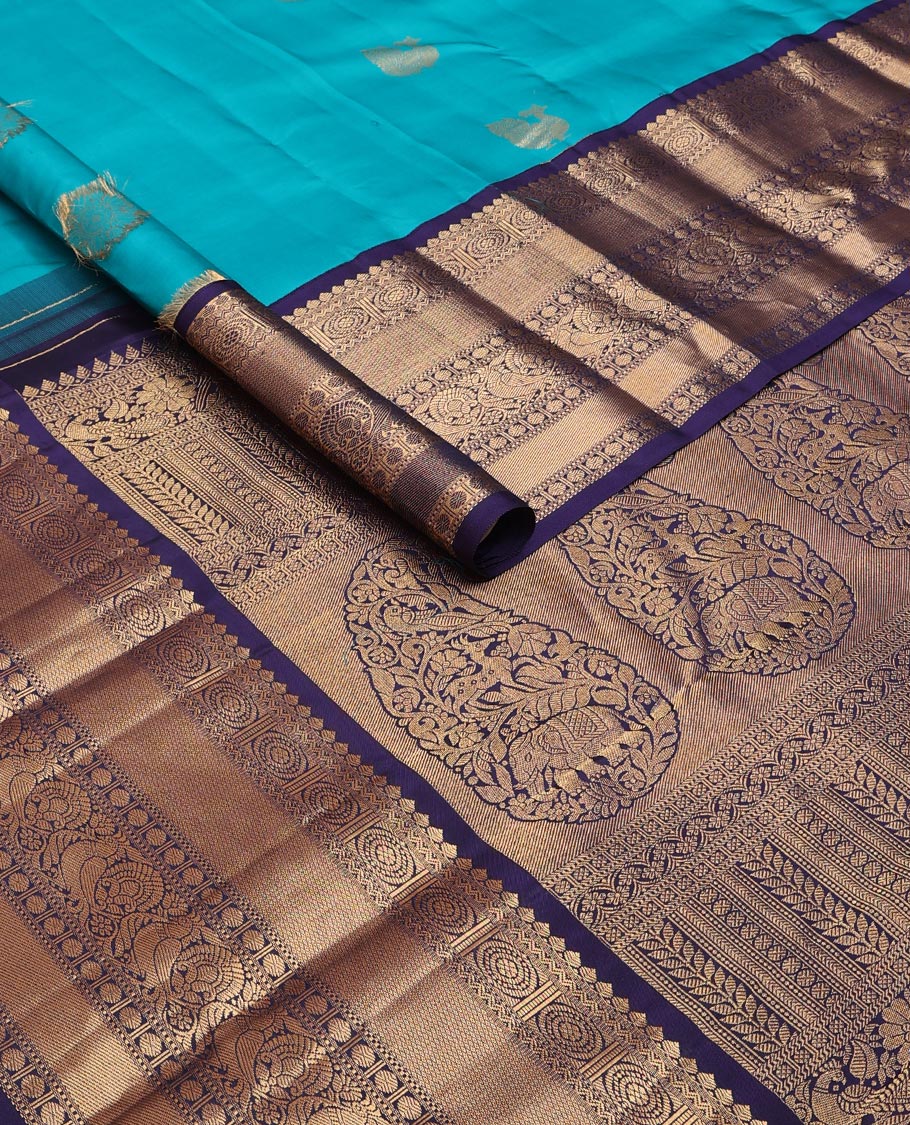 Blue zari buttas silk saree, contrast border of thilakam mokku,rettai neli,chakram,mayil kann, rudraksham & mayil & intricate pallu