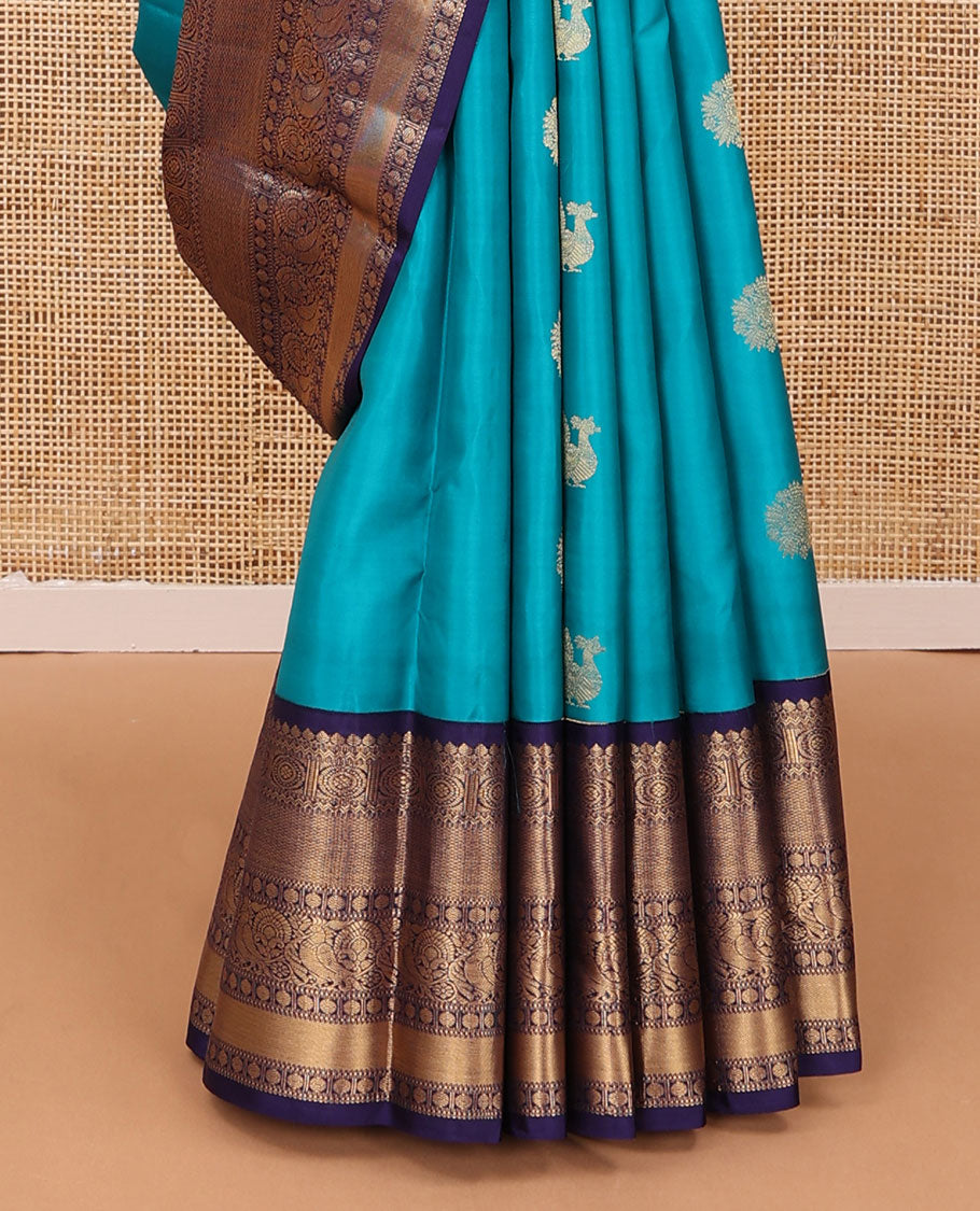 Blue zari buttas silk saree, contrast border of thilakam mokku,rettai neli,chakram,mayil kann, rudraksham & mayil & intricate pallu