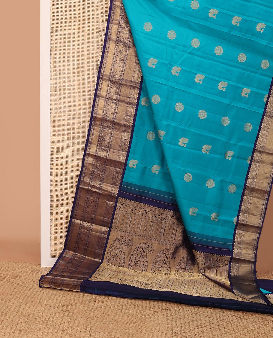 Blue zari buttas silk saree, contrast border of thilakam mokku,rettai neli,chakram,mayil kann, rudraksham & mayil & intricate pallu
