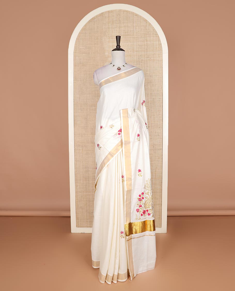 Cream floral motifs embroidered Kerala cotton saree, zari border, and floral embroidered pallu