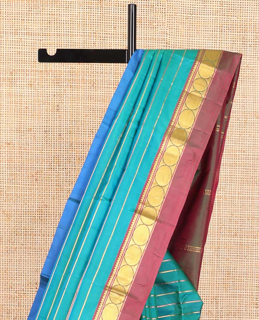 Dark blue striped kancheepuram with contrast border of paisley, muthu, kathir design & zari design pallu