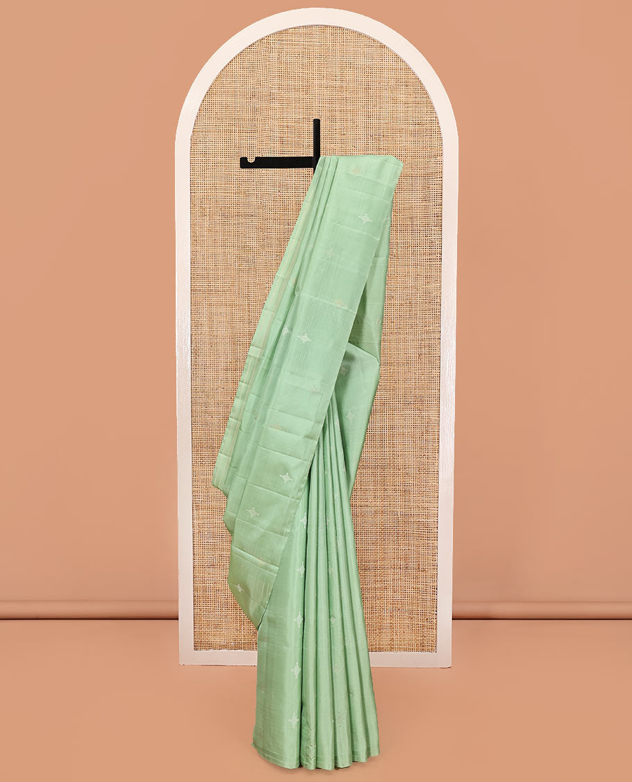 Borderless Green Mayuri Soft Silk Saree, Woven with Buttas All Over Its Body, Sparsely Sparkled Pallu, and Paired with a Matching Blouse
