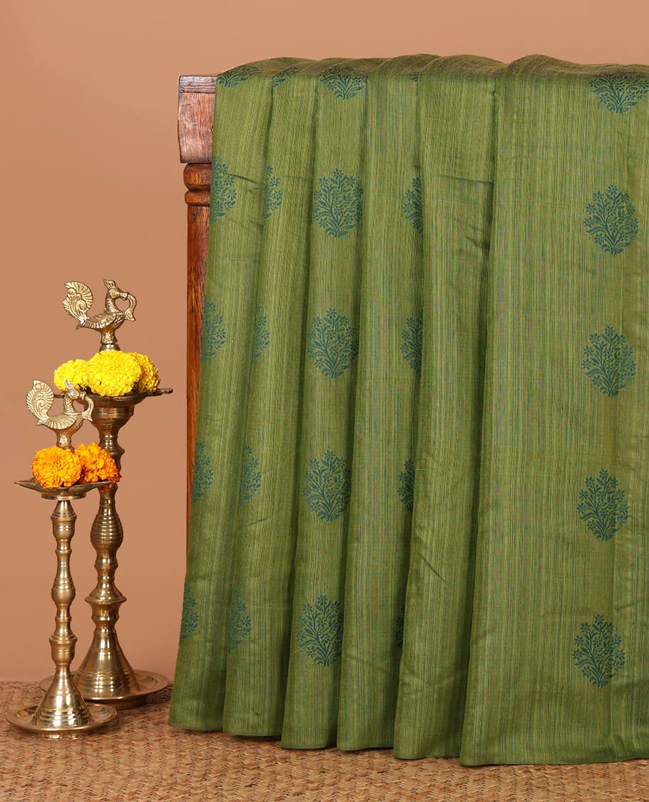 Borderless olive green banaras jute silk saree with floral thread buttas woven all over it's body, intricate pallu & butta design blouse