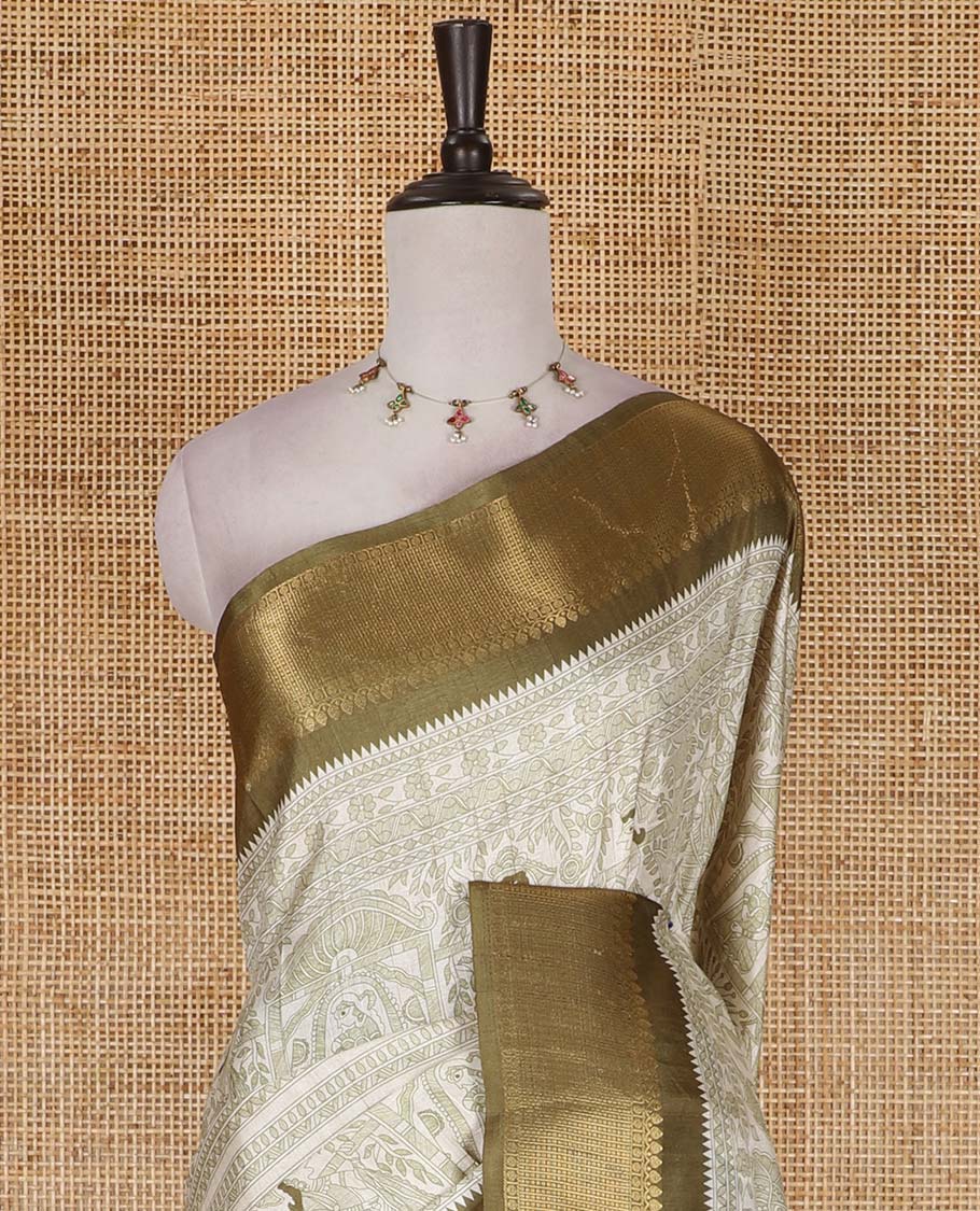 Cream and green Madhubani village theme characters printed soft tussar saree, contrast traditional zari border, Madhubani printed pallu, and a matching blouse