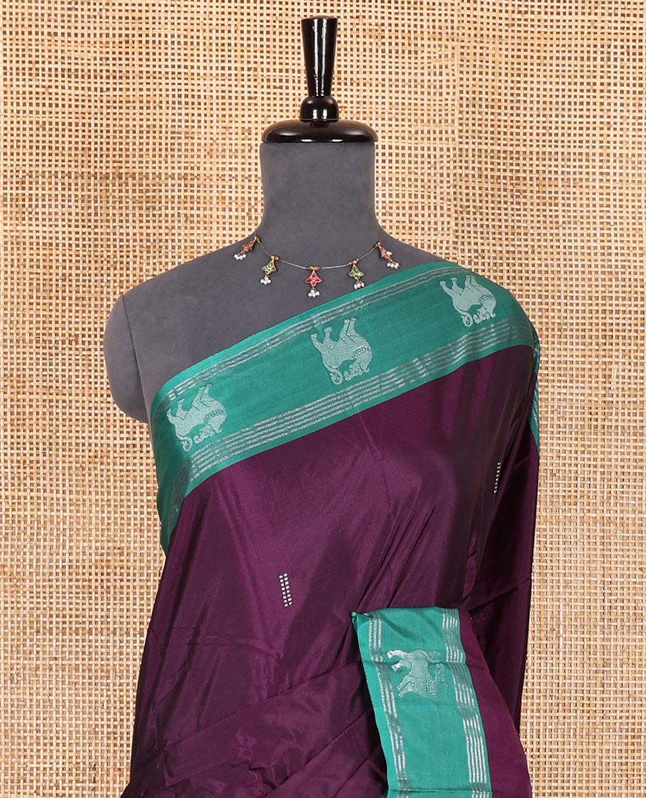 Purple zari buttas Kanchi silk saree, contrast yaali motifs zari green border, zari design pallu, and a matching blouse