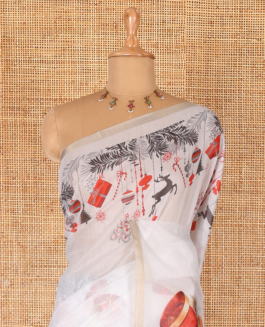 White Christmas-theme digital printed Chanderi cotton saree features bell motifs, piping zari border, big bell printed pallu, and blouse of tiny bell motifs print