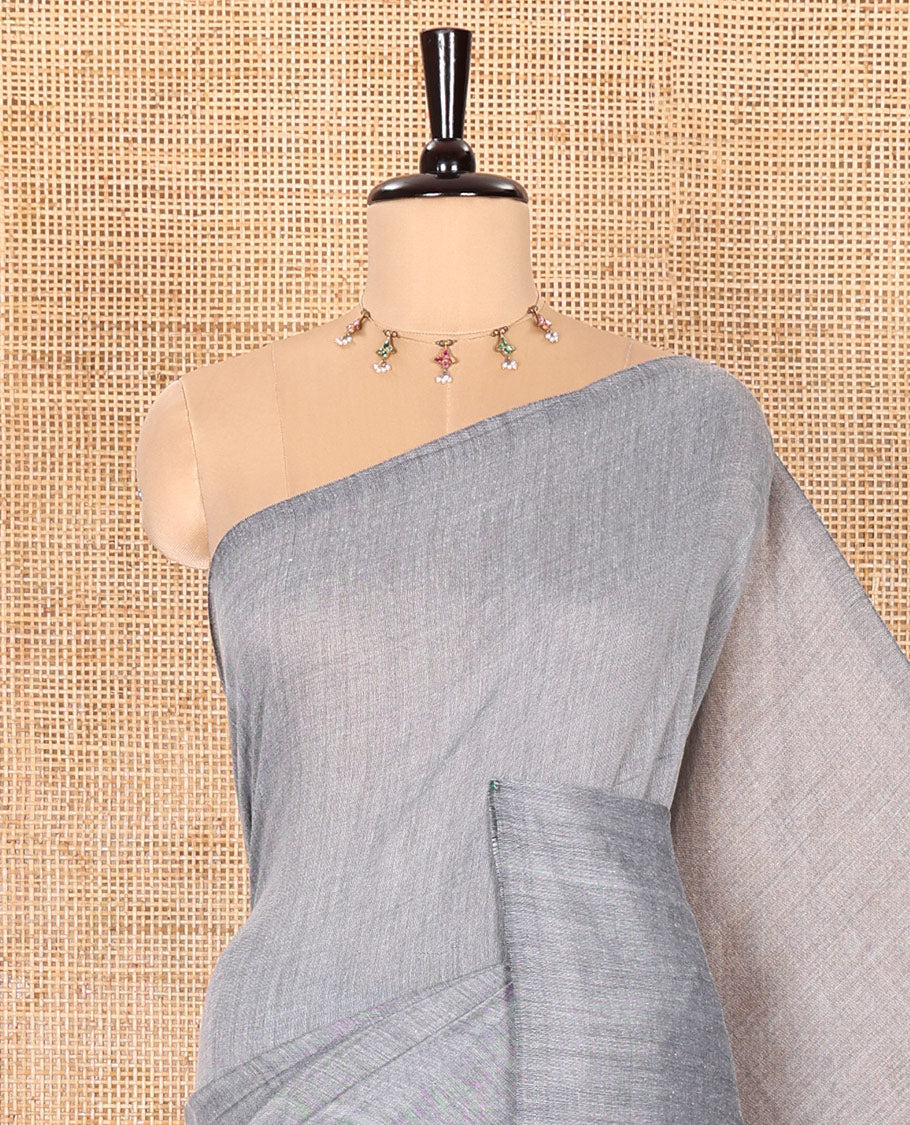 Borderless Grey Plain Khadi Mul Cotton Saree Featuring a Self Pallu with Tassels, Paired with a Matching Plain Blouse