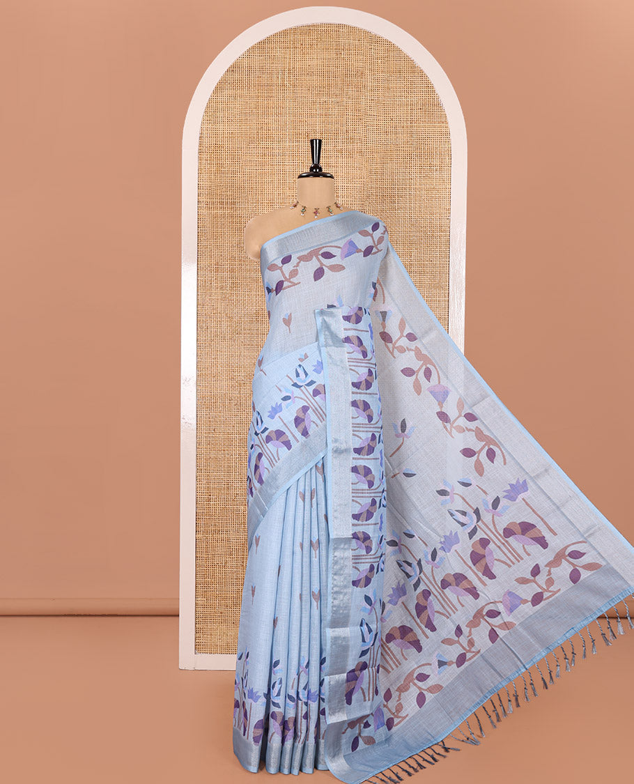 Sea Blue Linen Cotton Saree, Elevated with Jamdani-Style Lotus Designs Printed All Over Its Body, Zari Tissue Border, Pallu Mirrors the Same Print, and Paired with a Matching Blouse