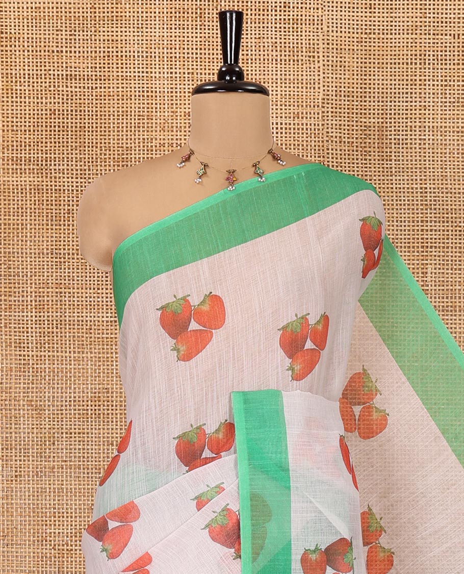 Cream Linen Cotton Saree, Artfully Printed with Stawberry Motifs All Over Its Body, Complemented by a Contrast Border, Checked Design-Printed Pallu, and Paired with a Contrast Blouse