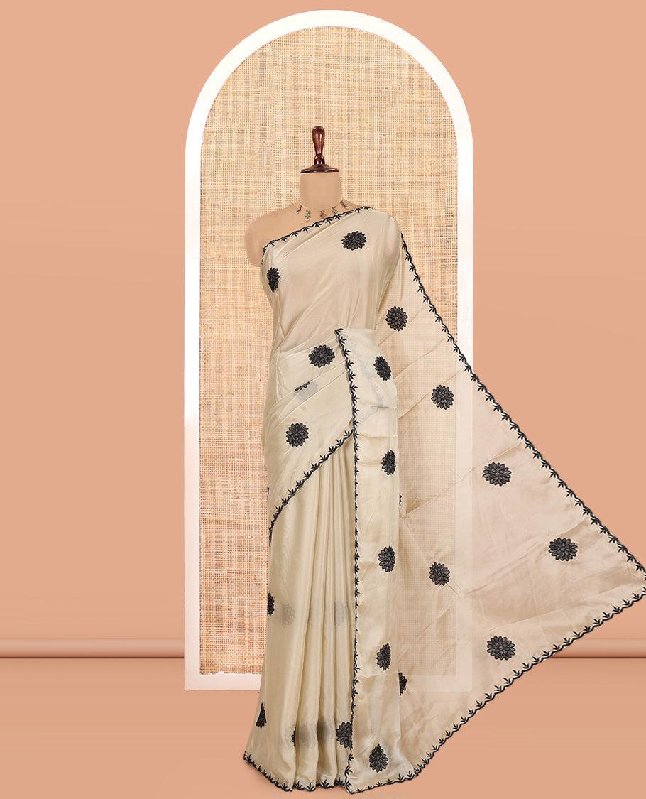 Chikku Chiffon Saree, Gracefully Embellished with Floral Embroidery Buttas, a Lace Embroidered Border, a Contrast Blouse