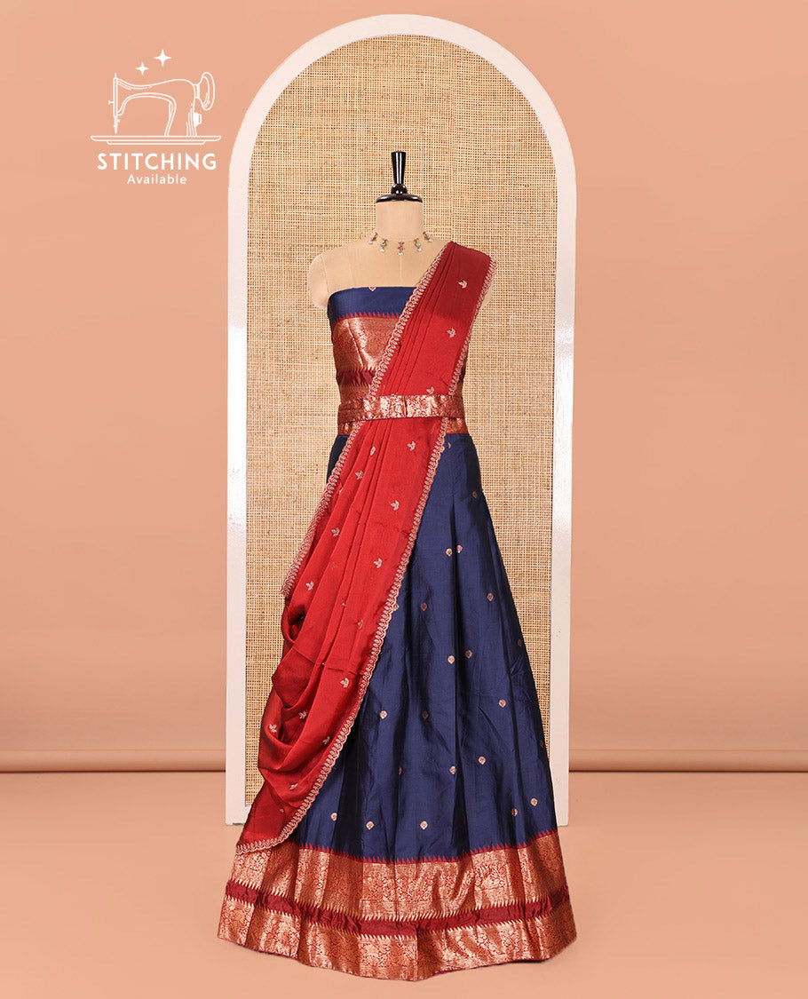 Navy Blue-Red Semi-Banarasi Half-Saree Adorned with Zari Buttas on Its Skirt, Complemented by a Contrast Traditional Zari Temple Rettai Pettu Border, Paired with a Matching Blouse, and a Satin Georgette Embroidered Scallop Dhavani