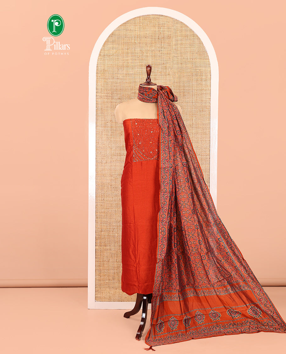 Rust Semi-Silk Material Chudidar Set Features Neck-Embroidered Top, a Santoon Bottom, and an Ajrakh Printed Dupatta