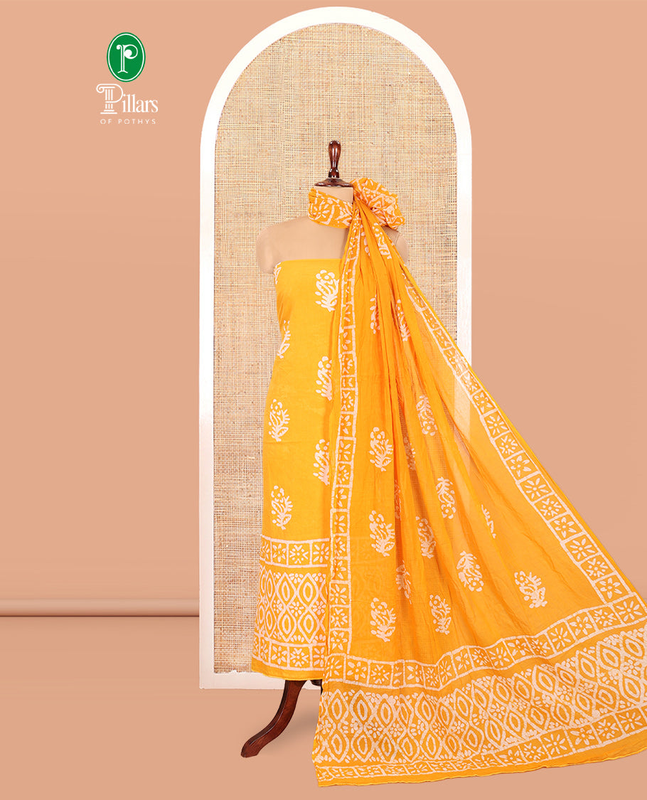 Yellow Cotton Material Chudidar, Batik Printed Top, a Matching Bottom, and Batik Print Dupatta