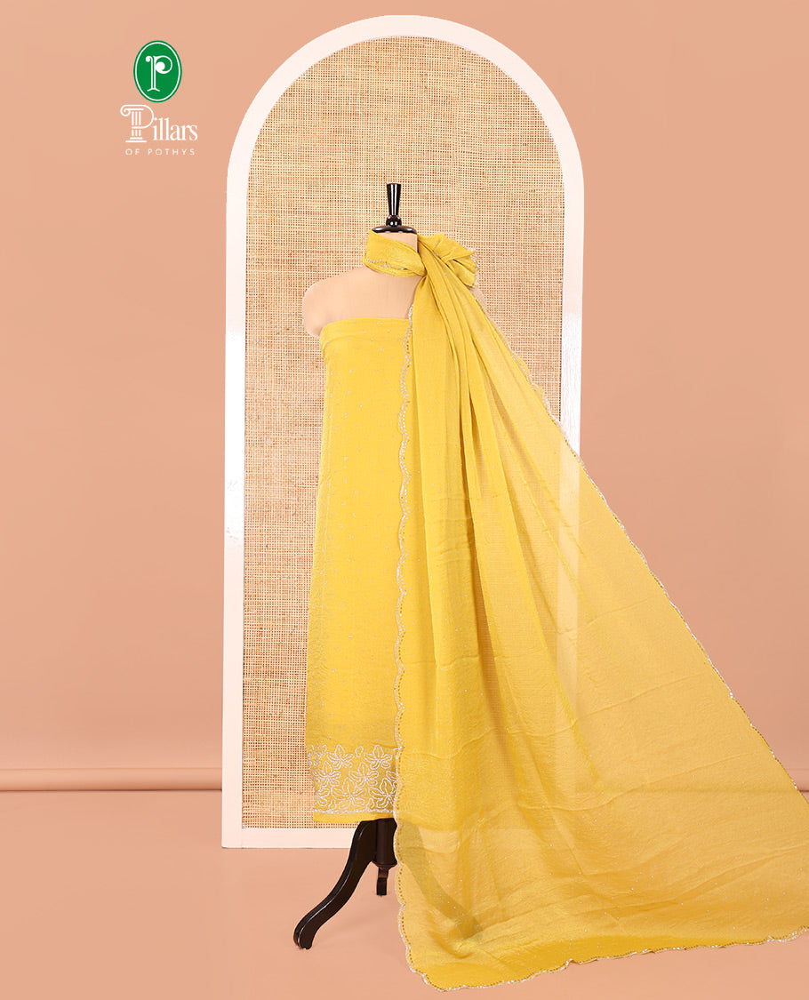 Yellow Moss Organza Material Churidar Set, Embellished with Floral Embroidery and Stone Struck on Its Top, a Plain Santoon Bottom, and Paired with a Moss Organza Stone Work Scallop Dupatta