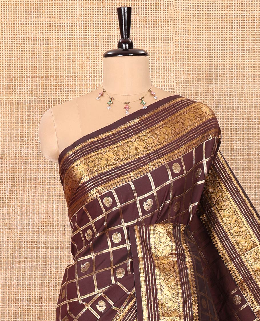 Coffee Brown Kanchipuram Budget Silk Saree Adorned with Peacock and Chakram Enclosed Checks, Highlighted with Varisai Pettu Border of Peacock Designs, Grandly Embellished Zari Pallu of Geometric Designs, and Paired with a Matching Blouse