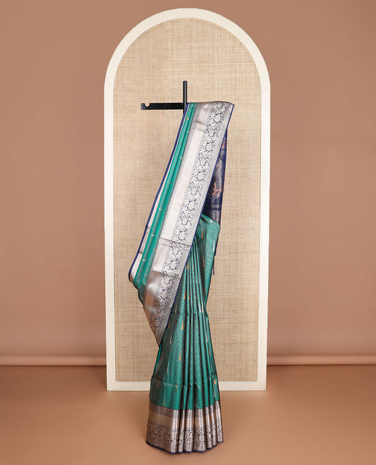 Green zari stripes, and rekku buttas soft silk saree, contrast traditional zari border, and intricate pallu