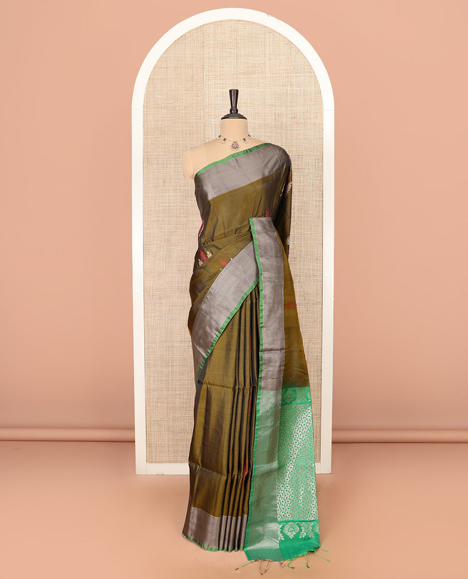 Green Semi Uppada Saree Highlighted with Leaf Buttas, Complemented by a Contrasting Border, Pallu Featuring Intricate Zari Designs, and Paired with a Contrast Blouse