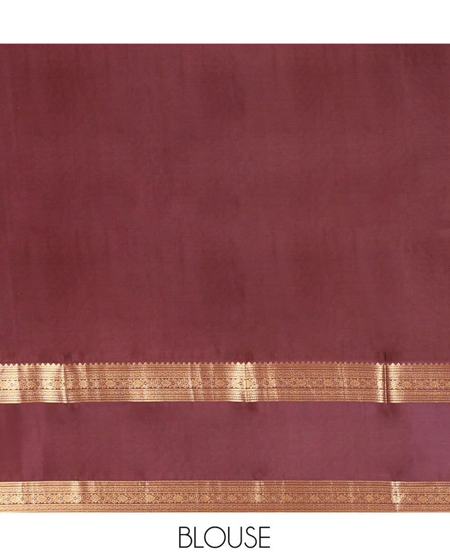 Orange Vasundhara Lite-Silk Mix Saree, Prettified with Zari Buttas, Complemented by Contrast Rettai Pettu Border Featuring Thilakam, Ara Bogudi, Neli, and Kamalam Designs, Grandly Woven Pallu of Floral Designs, and Paired with a Contrast Blouse