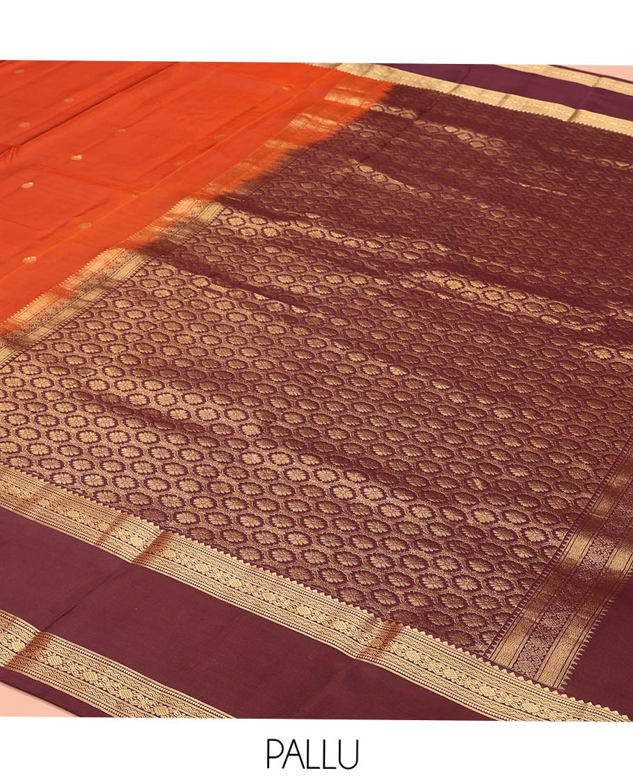Orange Vasundhara Lite-Silk Mix Saree, Prettified with Zari Buttas, Complemented by Contrast Rettai Pettu Border Featuring Thilakam, Ara Bogudi, Neli, and Kamalam Designs, Grandly Woven Pallu of Floral Designs, and Paired with a Contrast Blouse