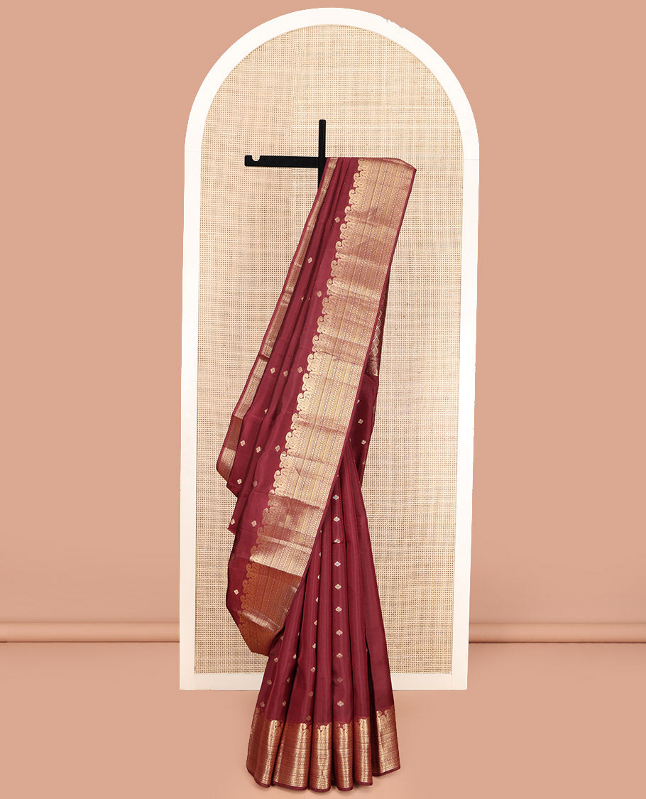 Maroon Vasundhara Lite Silk Mix Saree, Prettified with Zari Buttas, Highlighted by a Zari Border of Manga, and Geometric Designs, Pallu Adorned with Jaal Designs, and Paired with a Matching Blouse