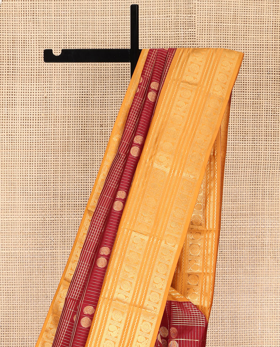 Orange Vasundhara Lite Silk Mix Saree, Majestically Detailed with Zari Butta Enclosed Checked Design on Its Body, Complemented by a Contrast Border of Neli, Kathir, Mayil, and Chakram Designs, Intricately Designed Pallu, and Paired with a Contrast Blouse