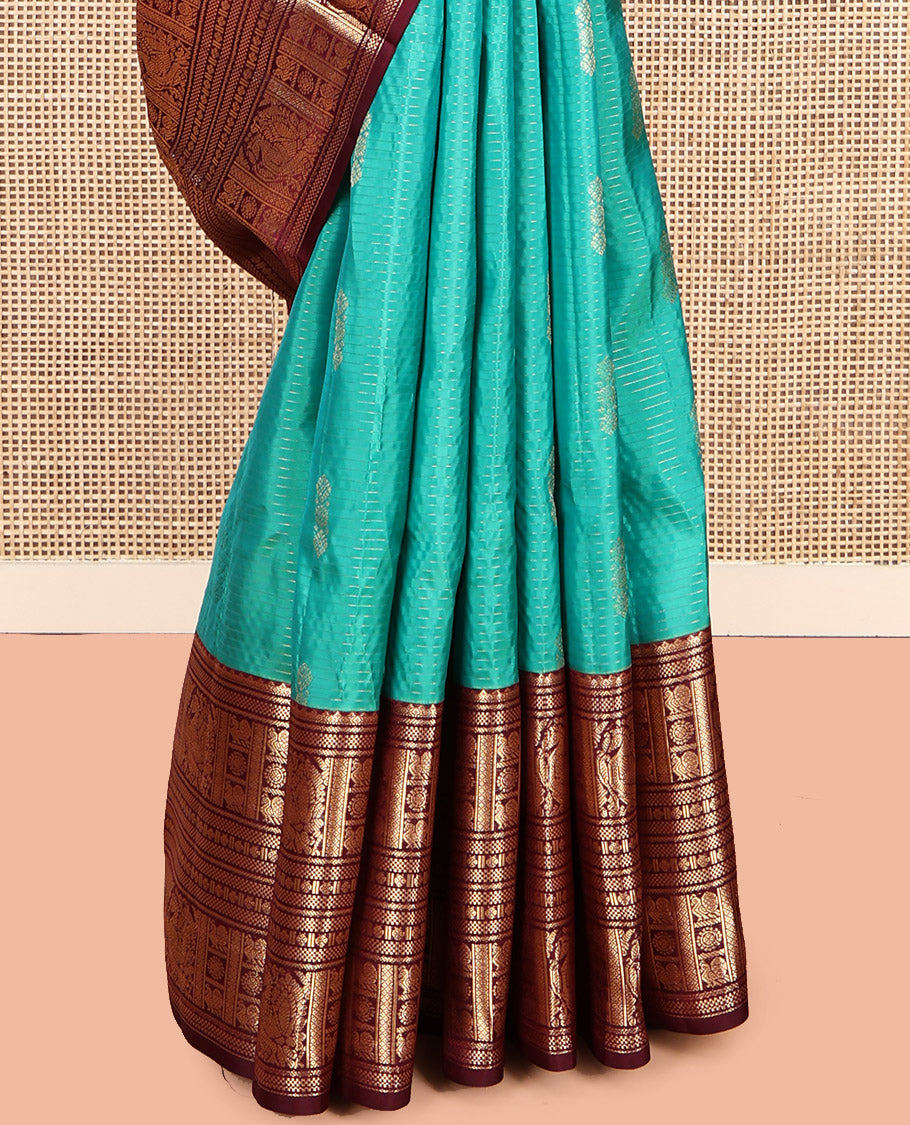 Green Vasundhara Lite Silk Mix Saree, Decked Up with Buttas and Stripes, Complemented by a Contrast Border of Bentex, Mayil Kann, Mayil, and Chakra, Intricate Pallu, and a Contrast Blouse
