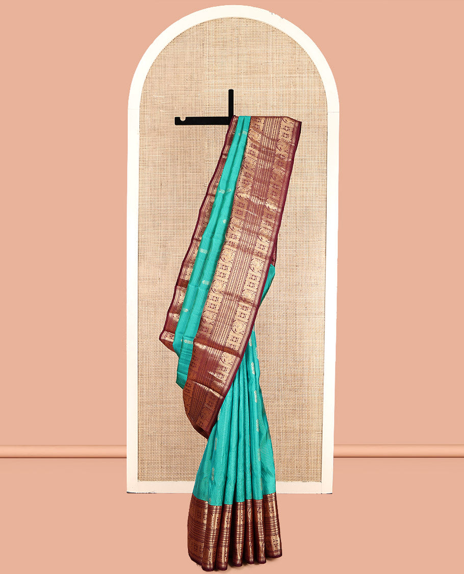 Green Vasundhara Lite Silk Mix Saree, Decked Up with Buttas and Stripes, Complemented by a Contrast Border of Bentex, Mayil Kann, Mayil, and Chakra, Intricate Pallu, and a Contrast Blouse