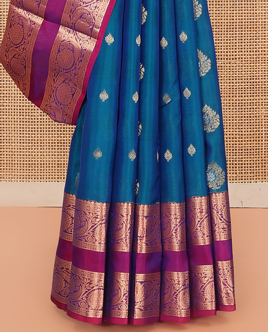 Blue Vasundhara Lite Silk Mix Saree, Prettified with Zari Buttas on Its Body, Complemented by a Contrast Rettai Pettu Border of Thilakam Mokku, and Kodi Visiry Designs, Opulently Embellished Pallu, and Paired with a Contrast Blouse