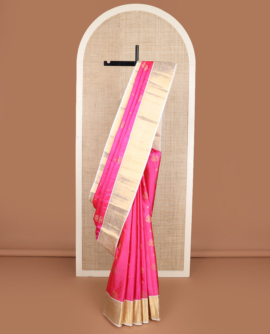 Pink zari buttas silk saree, contrast border of thilakam, diamond, laddu kamalam, muthu, kathir, mayil and chakram designs, and jaal pallu