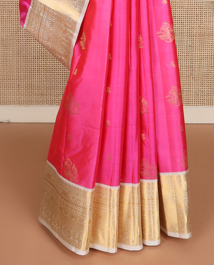 Pink zari buttas silk saree, contrast border of thilakam, diamond, laddu kamalam, muthu, kathir, mayil and chakram designs, and jaal pallu