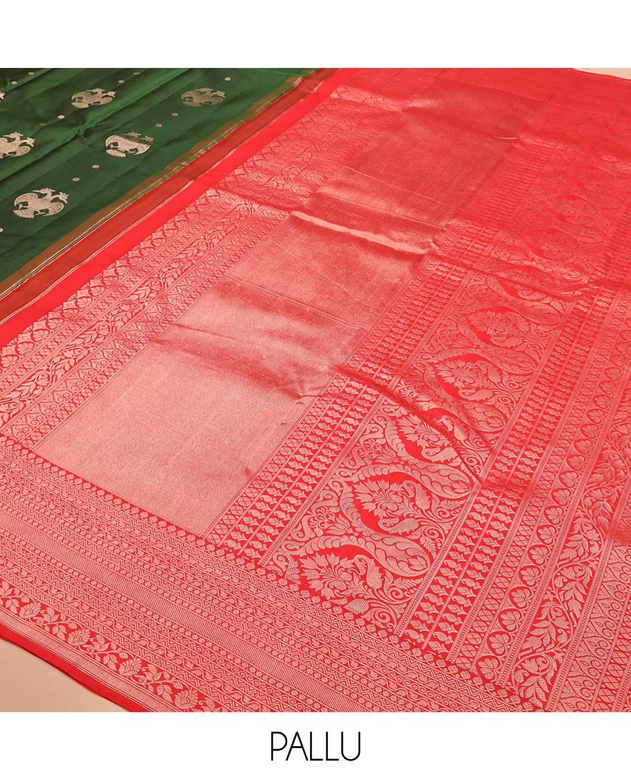 Green iruthalai pakshi buttas silk saree with contrast border of thilakam mokku, leaf vine, paisa, and kodi visiry designs, and intricate pallu