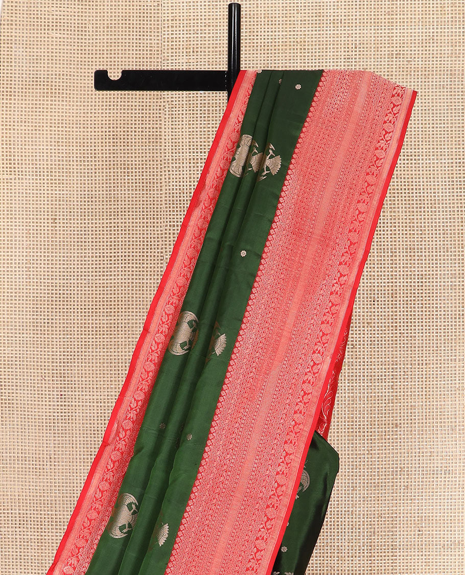 Green iruthalai pakshi buttas silk saree with contrast border of thilakam mokku, leaf vine, paisa, and kodi visiry designs, and intricate pallu