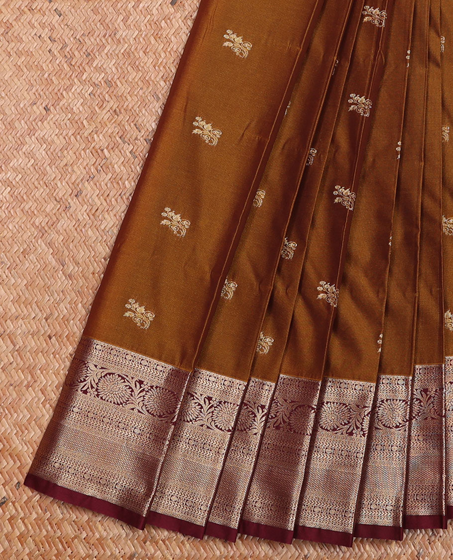 Brown Budget Silk Saree Elegantly Framed with Zari Buttas, Featuring a Contrast Traditional Zari-Design Border, Captivated with Mughal-Style Floral Butta Enclosed Arch Pallu, and a Contrast Blouse
