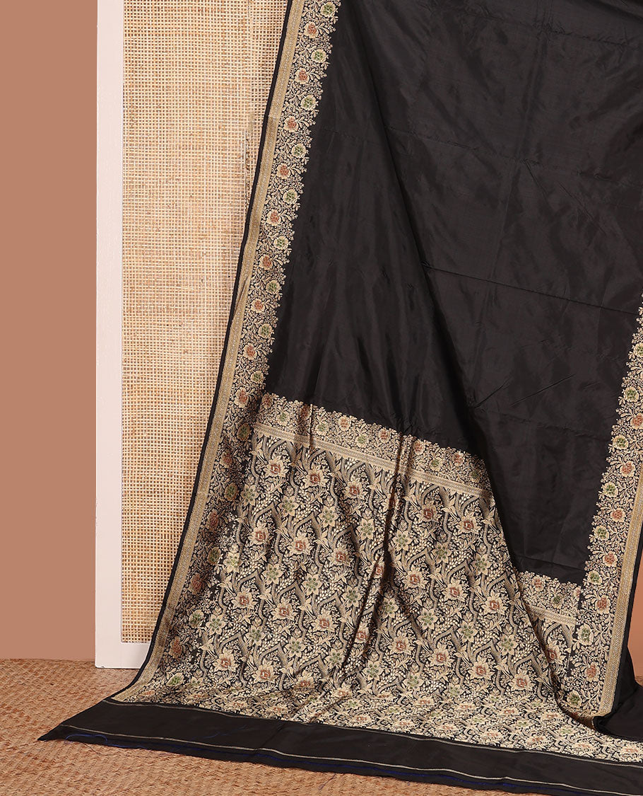 Black plain banarasi kathan silk saree, floral creeper meenakari border, and Mughal-style arches and floral design weave