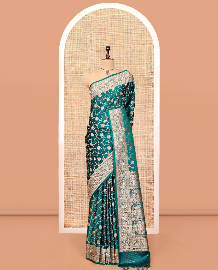 Green Banarasi Satin Saree, Bedecked with Floral Jaal Jacquard, a Floral Creeper Border, Intricate Stonework Pallu, and a Matching Blouse